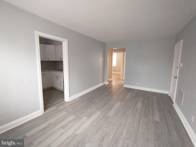 spare room featuring light hardwood / wood-style flooring