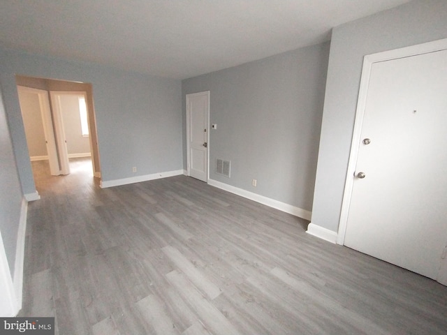 empty room featuring hardwood / wood-style floors