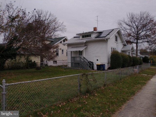 3800 40th Ave, Brentwood, MD 20722 - exterior space with a yard and solar panels