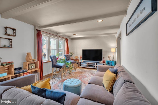 living room featuring brick wall and beam ceiling