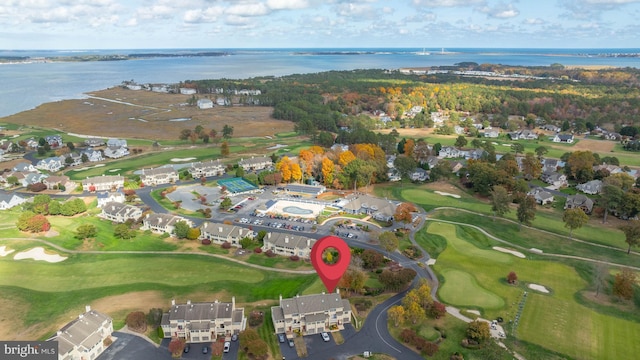 aerial view featuring view of golf course and a water view