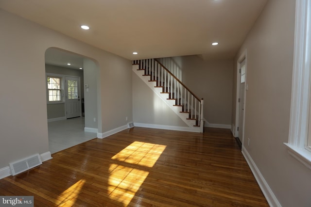 interior space with dark hardwood / wood-style floors