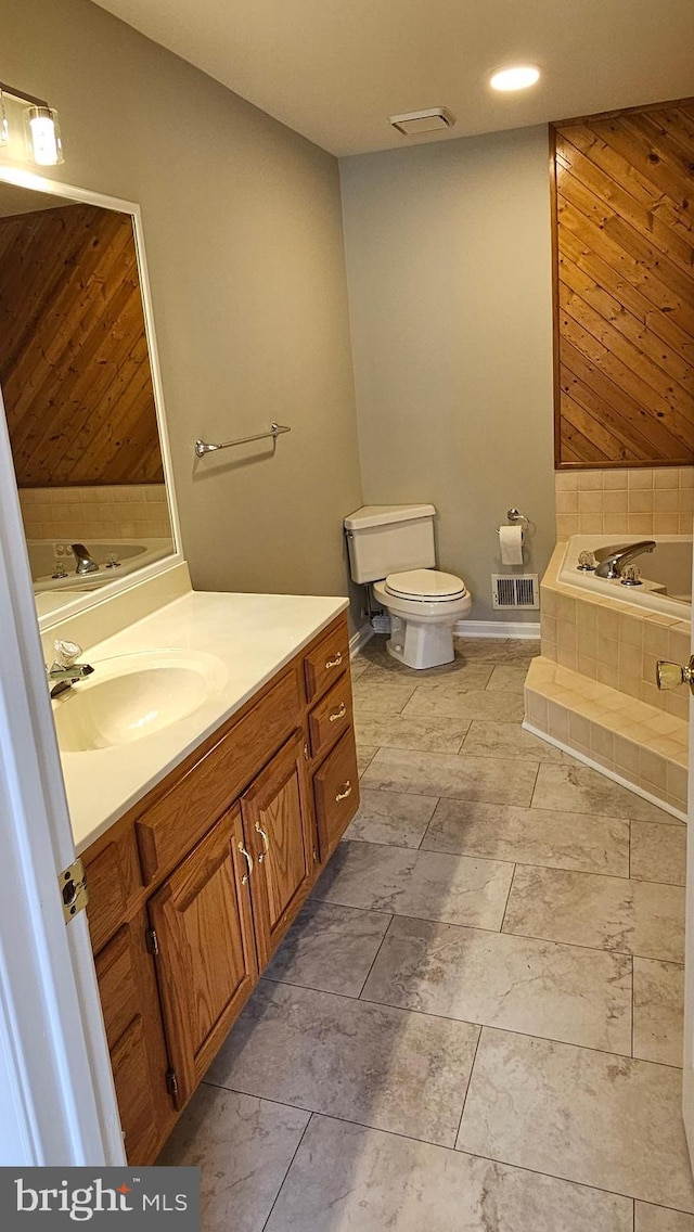 full bath with a bath, visible vents, toilet, and vanity