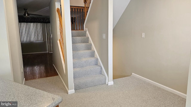 stairway featuring baseboards