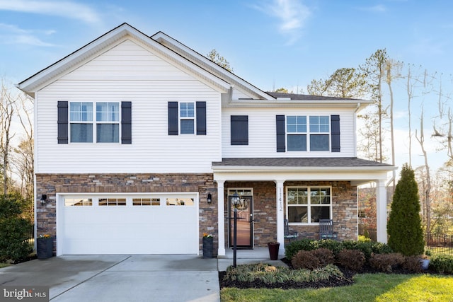 view of front of home featuring a garage and covered porch