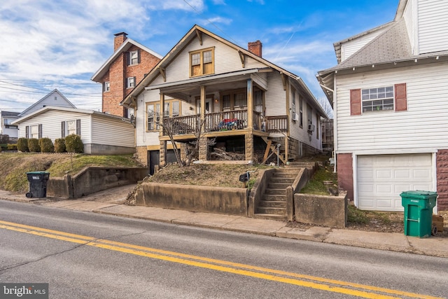 view of front of house featuring a garage and covered porch