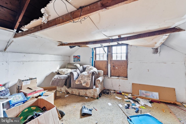 interior space featuring vaulted ceiling with beams