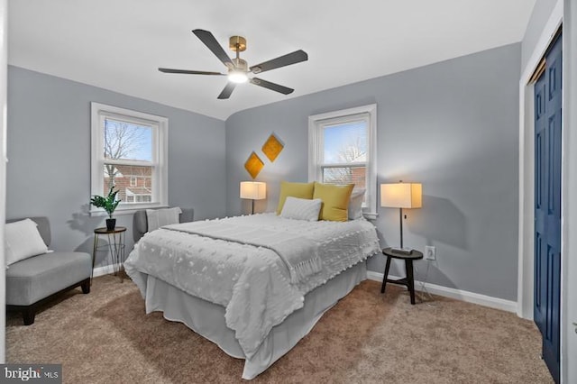 bedroom featuring carpet floors, a closet, ceiling fan, and baseboards