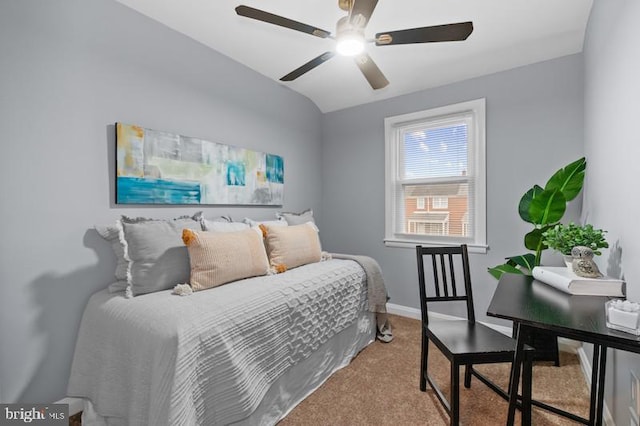 bedroom with a ceiling fan, baseboards, vaulted ceiling, and carpet flooring