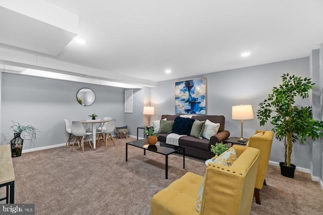 carpeted living room featuring baseboards and recessed lighting