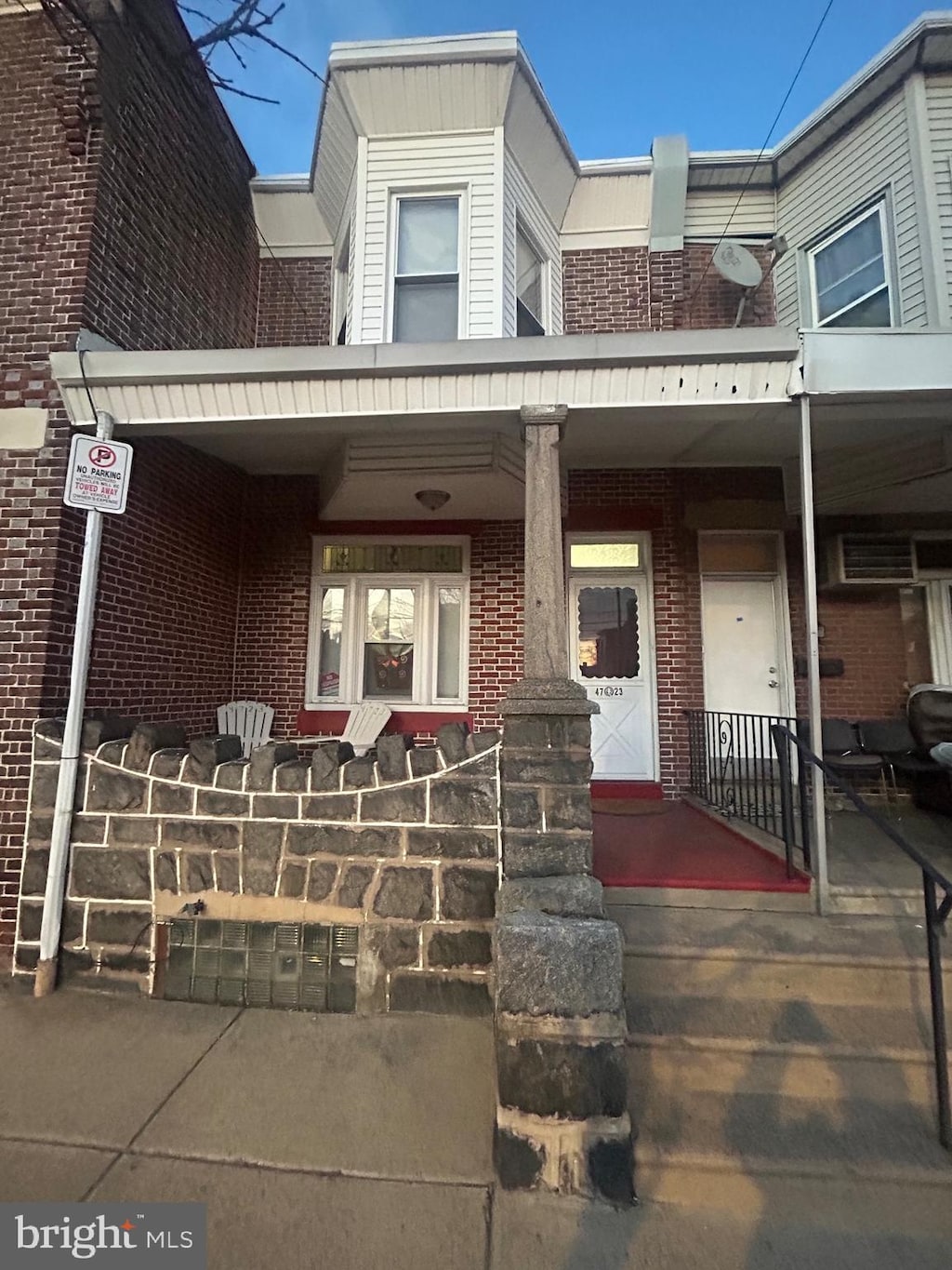 view of property featuring covered porch