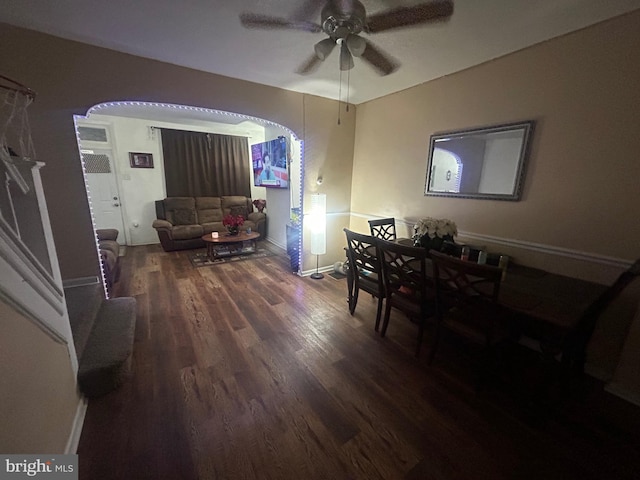 dining space with ceiling fan and dark hardwood / wood-style floors