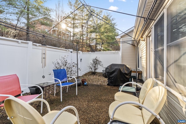 view of patio featuring a grill