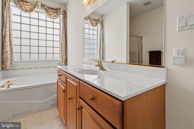 bathroom featuring independent shower and bath and vanity