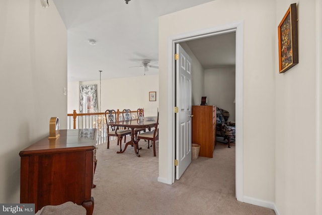 hallway with light carpet