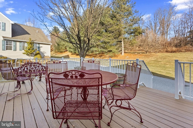 wooden deck with a yard