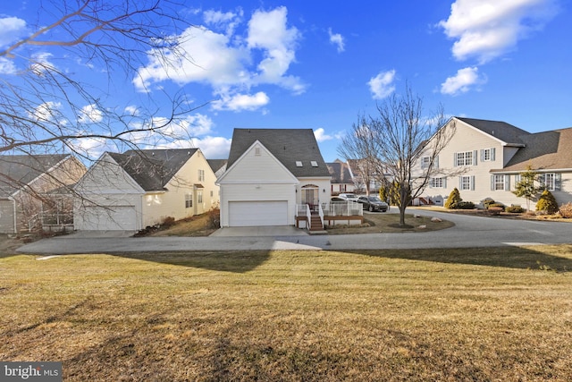 exterior space featuring a front yard and a garage