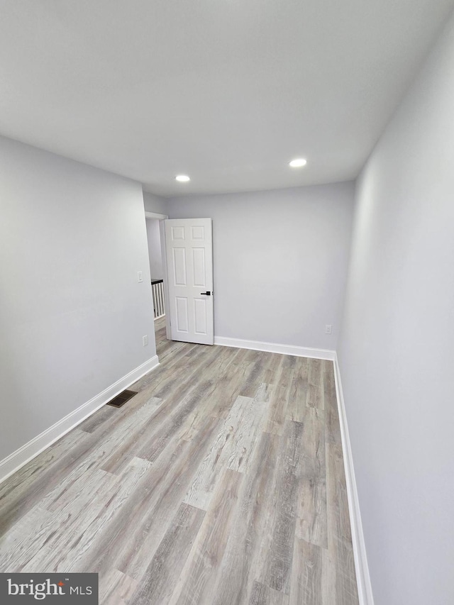 basement featuring light hardwood / wood-style floors