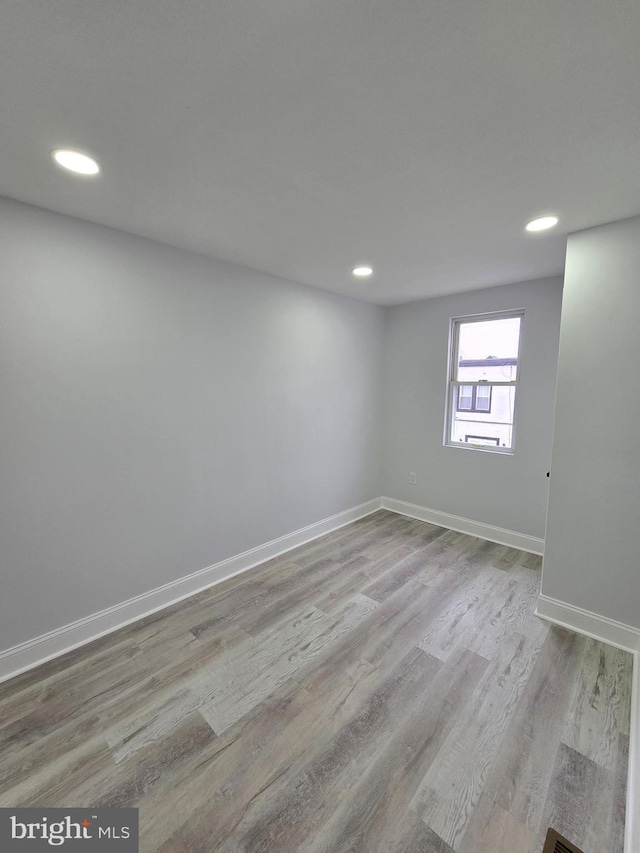 unfurnished room featuring light wood-type flooring