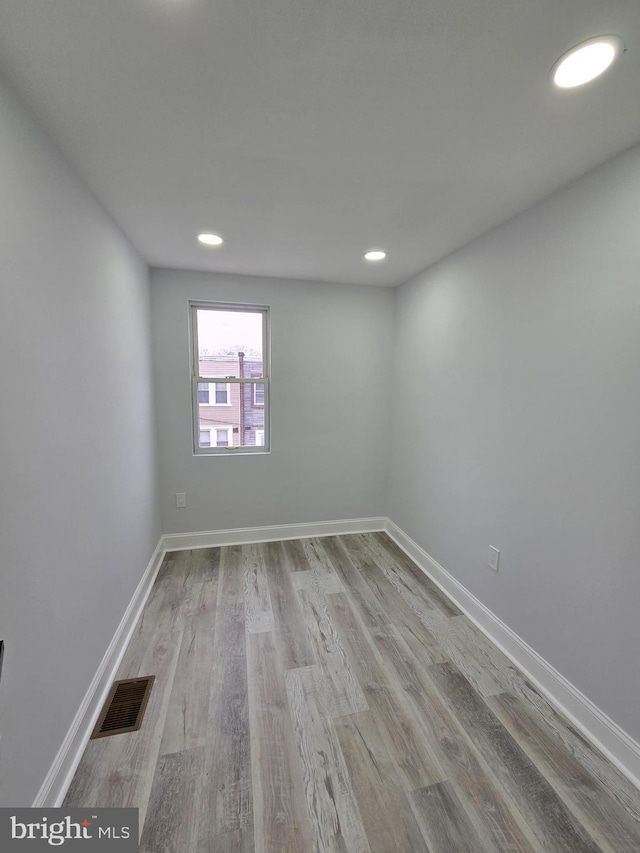 spare room featuring light hardwood / wood-style floors