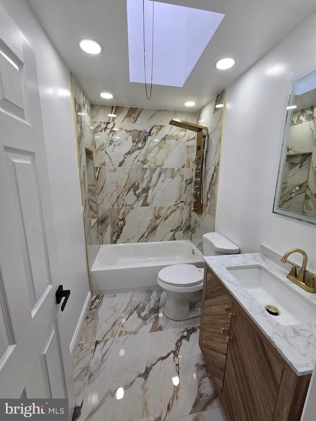 full bathroom with tiled shower / bath, toilet, vanity, and a skylight