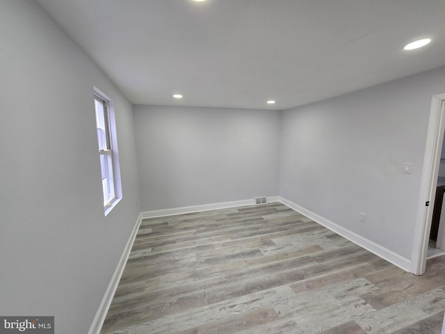 unfurnished room with light hardwood / wood-style flooring