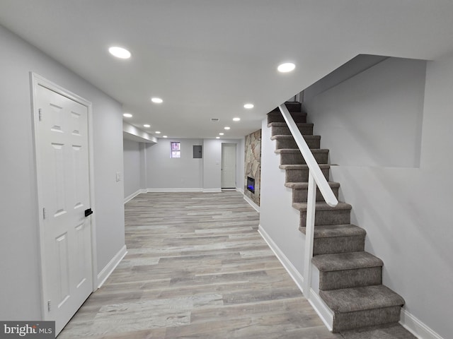 basement featuring light wood-type flooring