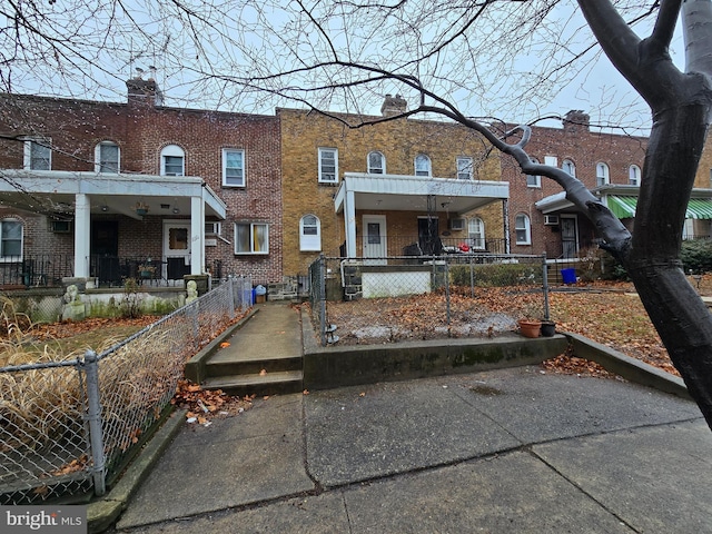 back of property featuring covered porch