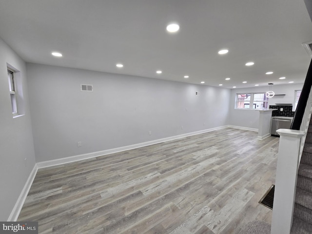 basement featuring light hardwood / wood-style floors