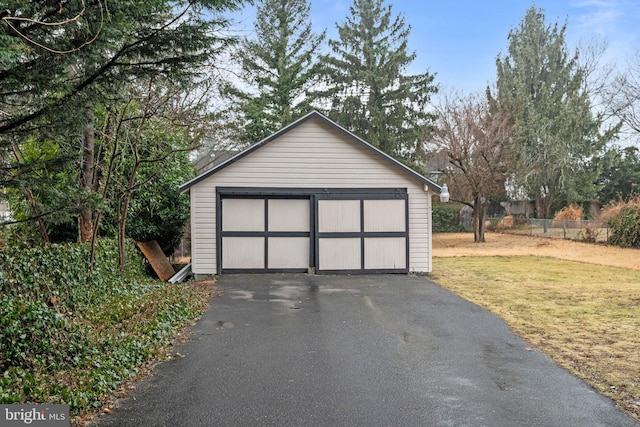 garage featuring a lawn