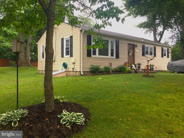 ranch-style home with a front lawn