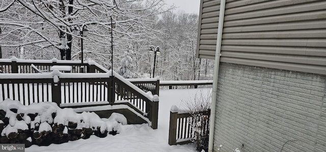 view of snow covered deck