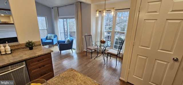 sitting room with light wood-type flooring and a wealth of natural light