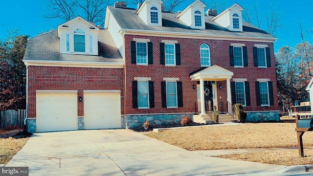 colonial inspired home with a garage