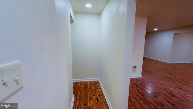 hall with hardwood / wood-style floors