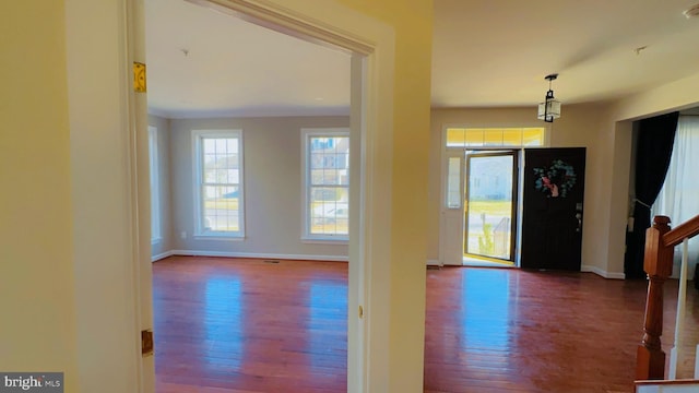 entryway with dark hardwood / wood-style floors