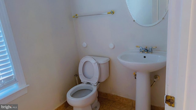 bathroom featuring tile patterned flooring and toilet