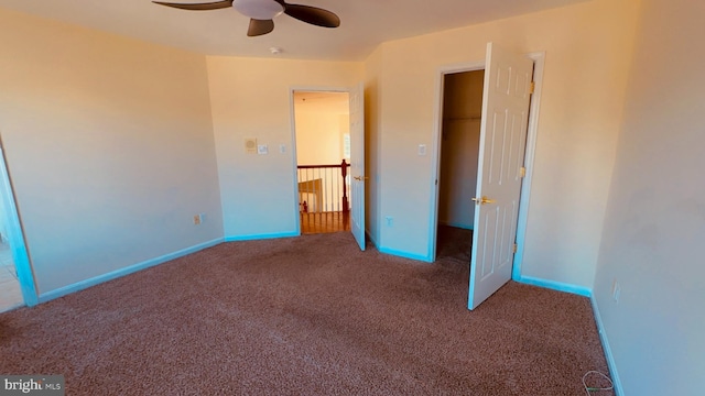 unfurnished bedroom with ceiling fan and carpet floors