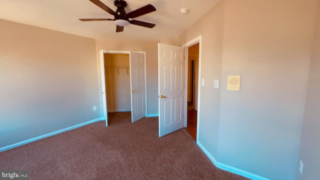 unfurnished bedroom featuring ceiling fan, carpet floors, and a closet