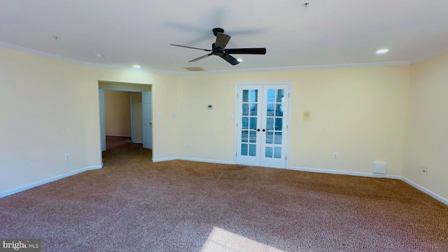 carpeted spare room with ornamental molding, french doors, and ceiling fan