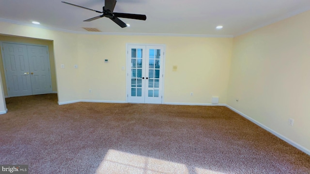 carpeted spare room with ornamental molding, french doors, and ceiling fan