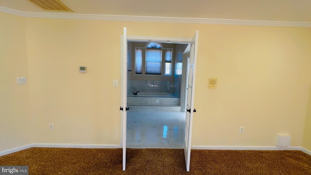 interior space with ornamental molding and carpet floors