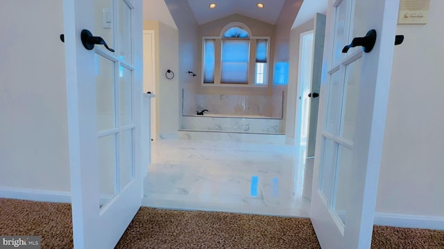 interior space featuring lofted ceiling and carpet flooring