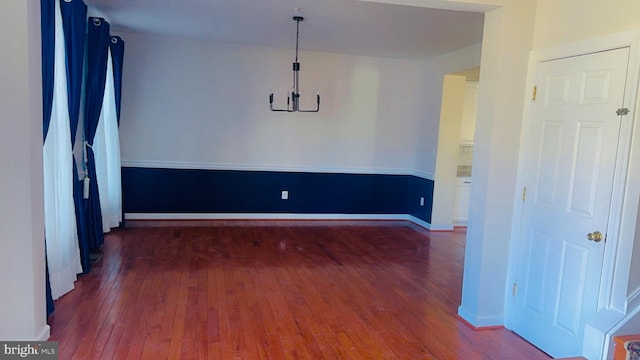 unfurnished room featuring dark hardwood / wood-style floors