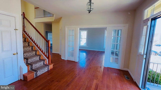 entrance foyer featuring wood-type flooring