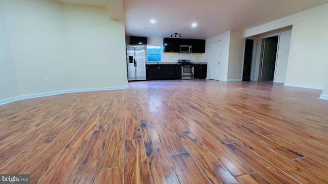 unfurnished living room with hardwood / wood-style floors