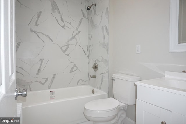 full bathroom with vanity, toilet, and tiled shower / bath