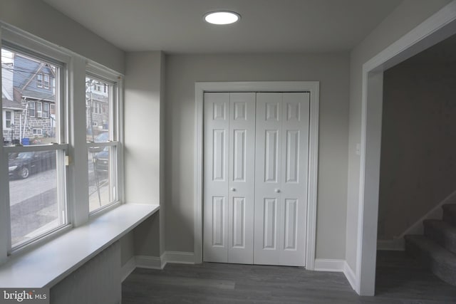 hallway featuring dark hardwood / wood-style floors