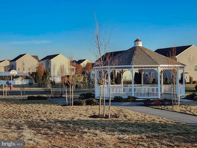 view of property's community with a gazebo and a lawn