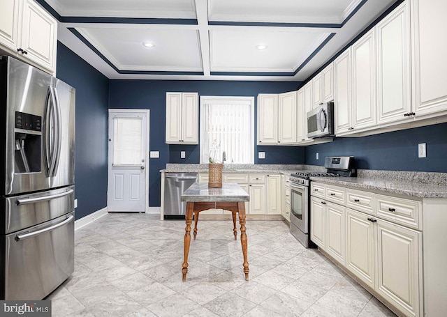 kitchen featuring stainless steel appliances, light stone countertops, coffered ceiling, and beam ceiling